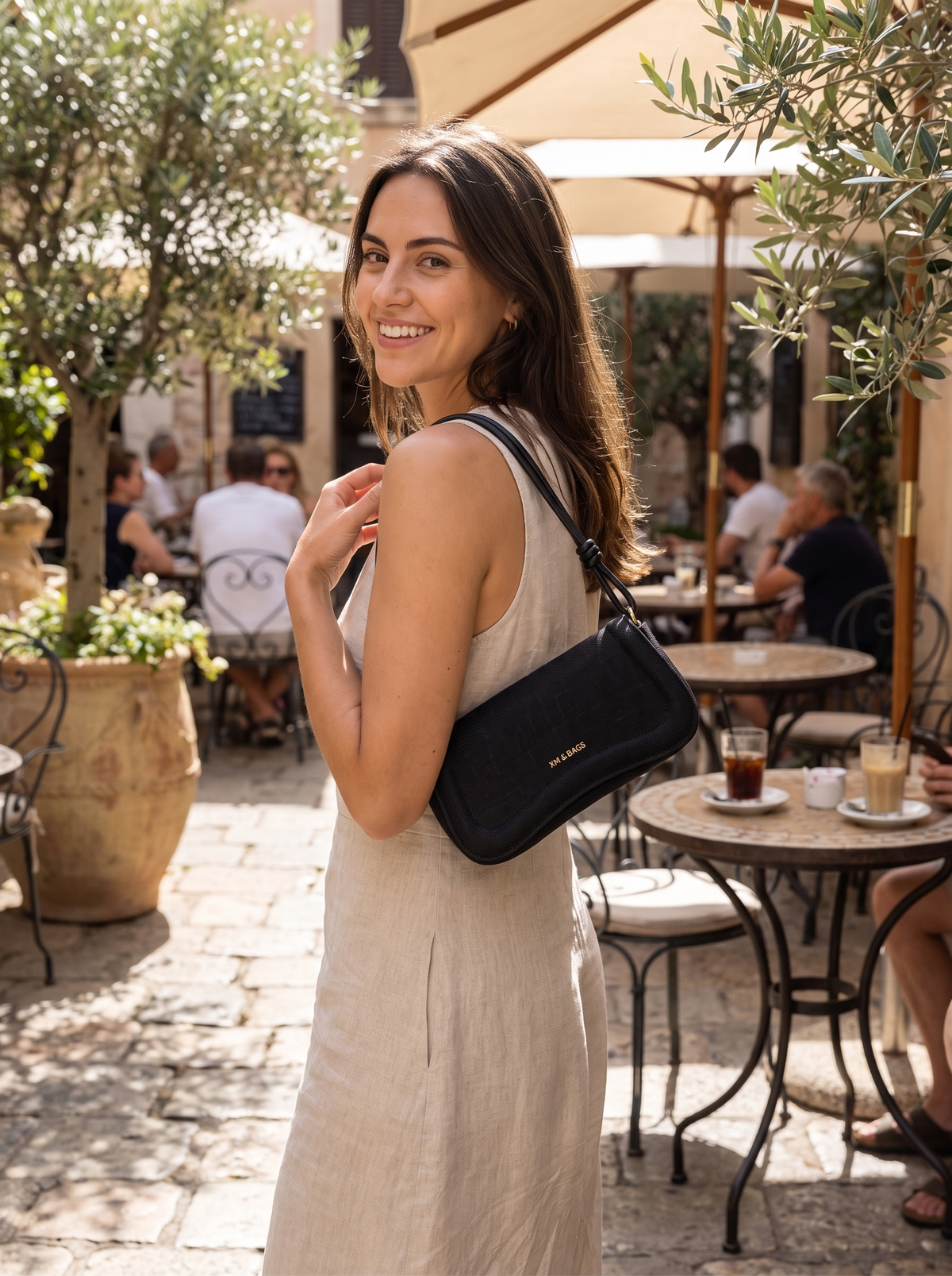 Linen Baguette Shoulder Bag on a sunlit terrace