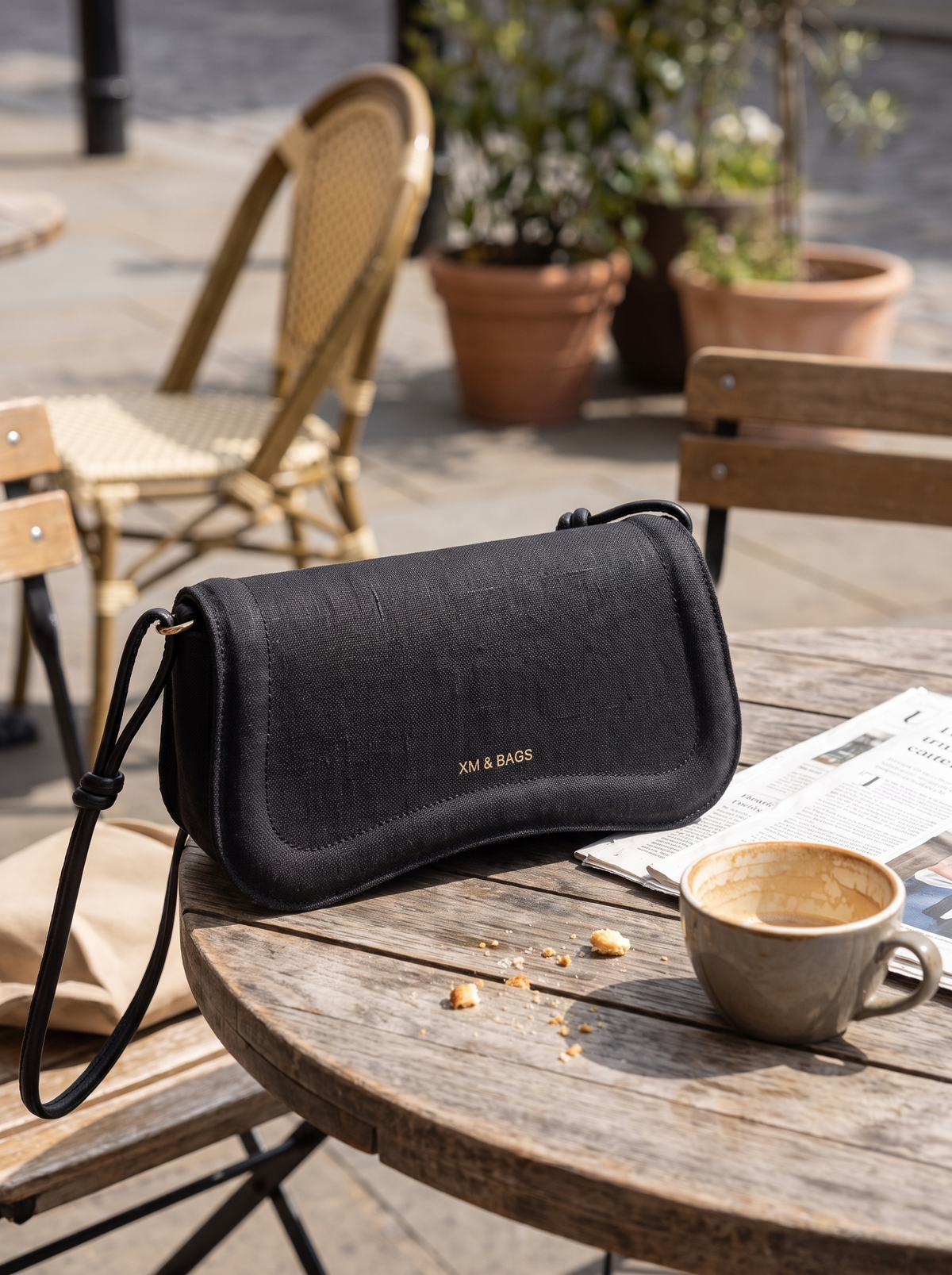Linen Baguette Shoulder Bag weave detail at a cafe